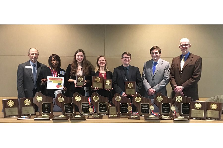 Members of the Madison College Business Professionals of America Club show the awards they won.