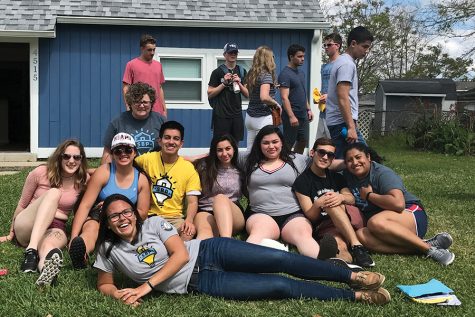 Some of the Madison College students on the New Orleans alternative break trip gather for a photo at a welcome home party for one of the families.