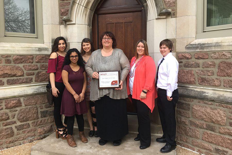 Members of the Volunteer Center pose with their Action Program of the Year Award.