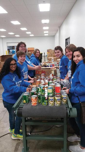 Members of the Volunteer Center participate in a service learning activity.