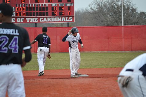 Madison College’s Logan Michaels holds his hand to his ear, jokingly telling his teammates he can’t hear them cheering, after hitting a two-run double in the second game of a double header against Prairie State College on April 2. Madison College posted a 14-0 victory in the game, which was played at Sun Prairie High School.
