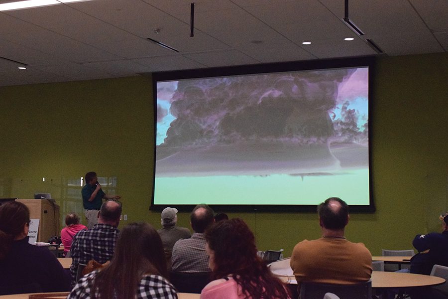 Participants in the Dark Skies Severe Weather Seminar view an image of a shelf cloud.