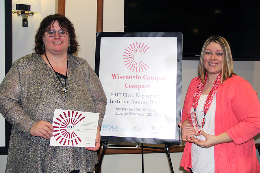 Madison College students Gloria Stendel, left, and Samantha Hunter display the awards they received at the annual Wisconsin Campus Compact Awards Dinner on April 6. Stendel was named a 2017 Newman Civic Fellow, while Hunter won the Jack Keating Student Civic Leadership Award.