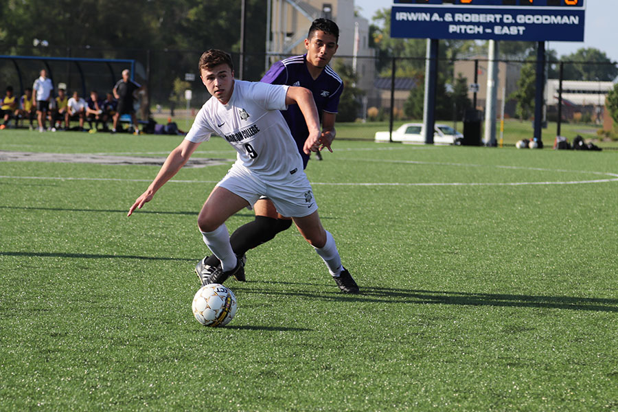 Madison College men’s soccer player Shane Paterson takes control of the ball in front of an opponent during a recent match.