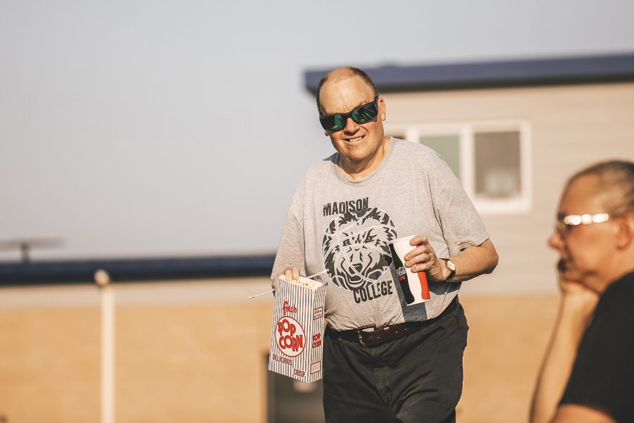 Coach Breneman walking to the bleachers at a women’s soccer game versus Joliet Junior College.