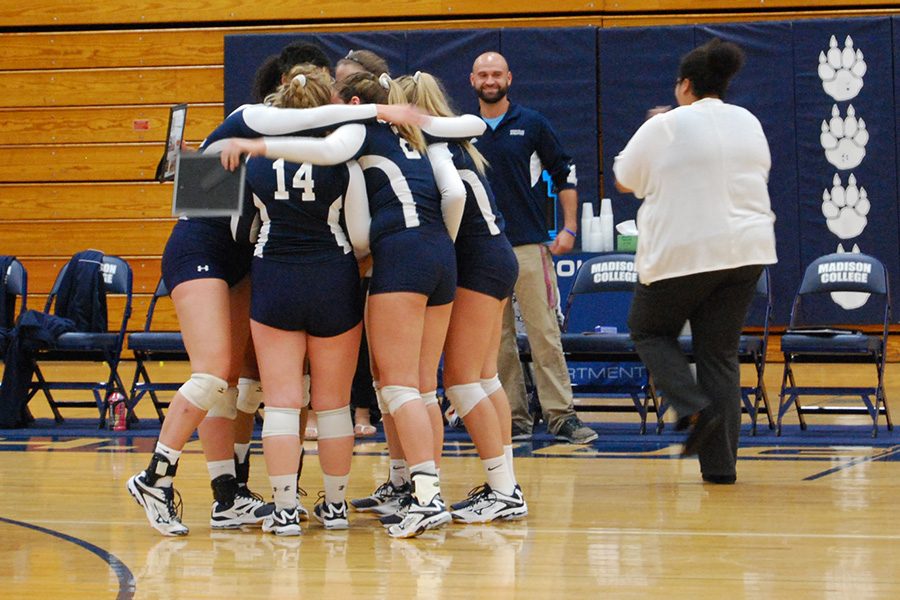 The sophomores on the volleyball team gather on the court after being recognized prior to their match against Milwaukee Area Technical College.