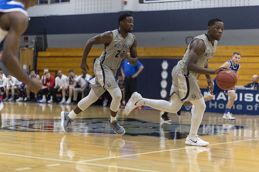 Madison College’s Tyree Young, right, leads a fast-break against Elgin Community College on Dec. 2 as teammate Brandon Robinson (24) follows.