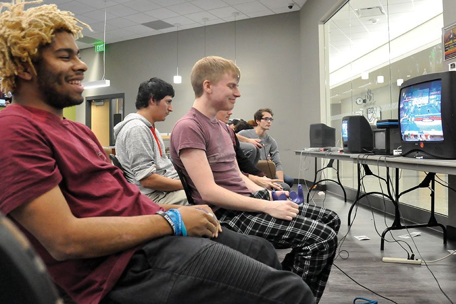 Members of Madison College's Smash Club compete in "Super Mario Smash" in the WolfPack Den late on a Friday afternoon.