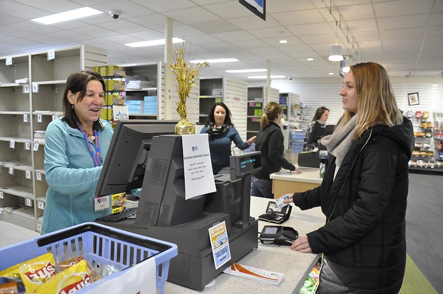 Student purchases textbooks at Truax Bookstore on Thursday, Jan. 11.