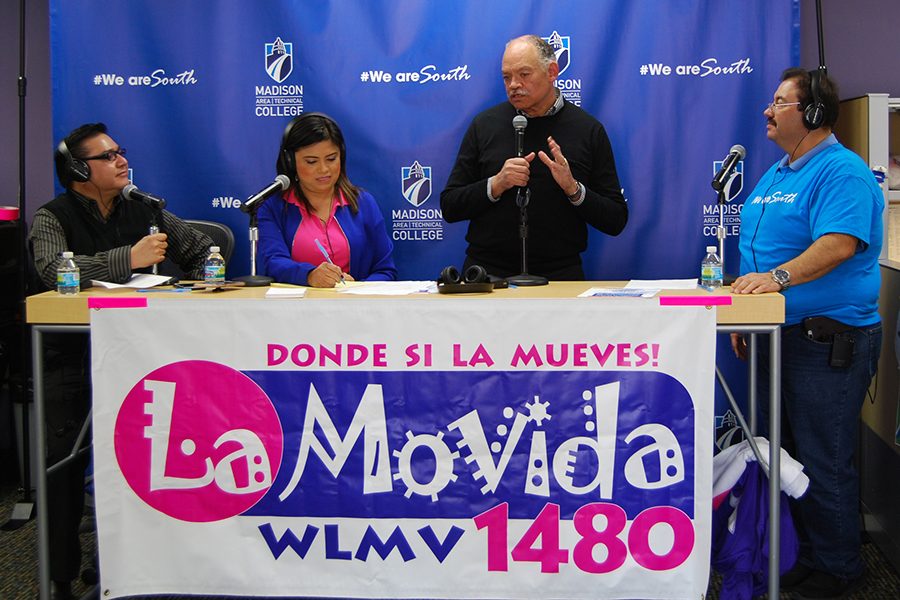 Madison College President Dr. Jack Daniels joins La Movida radio announcers on the air on April 20.