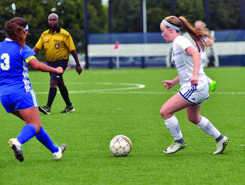 Madison College freshman Kaitlin Satern, right, moves in to steal the ball from an opponent during a home game on Sept. 7.