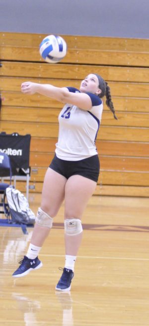 Madison College’s libero Paige Alsum receives a serve