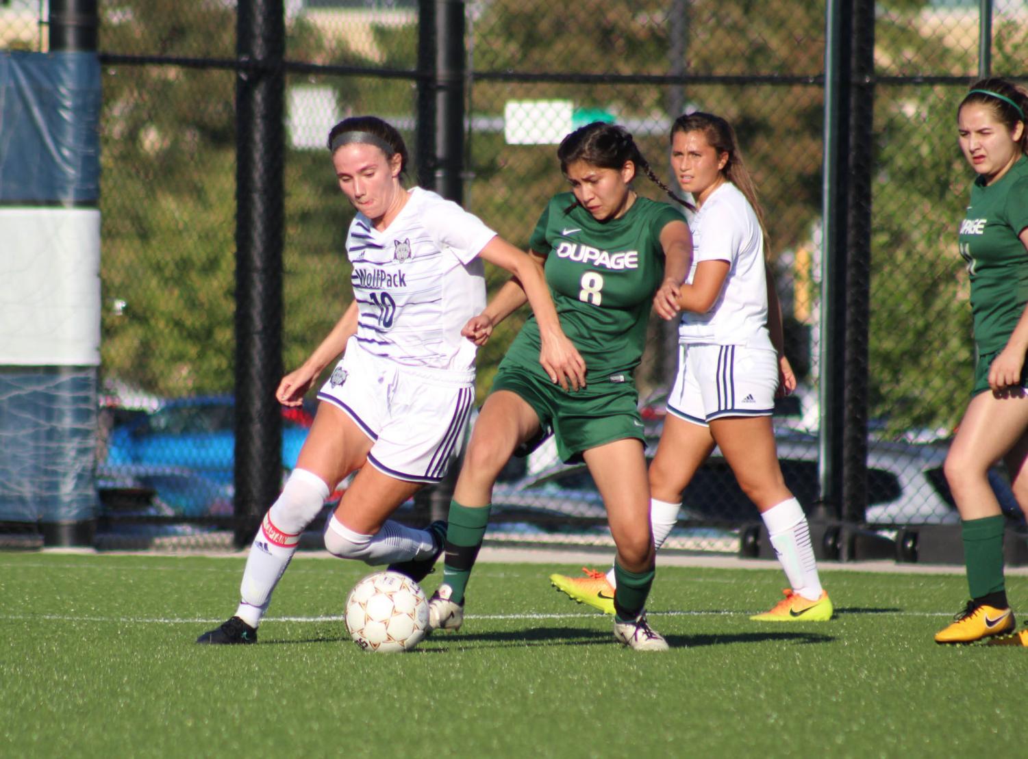 Madison College’s Peyton Trapino fights a College of DuPage player for the ball during her team’s 5-0 win at home on Sept. 10. The WolfPack women’s soccer team is now 7-1 overall and 6-0 in conference play.