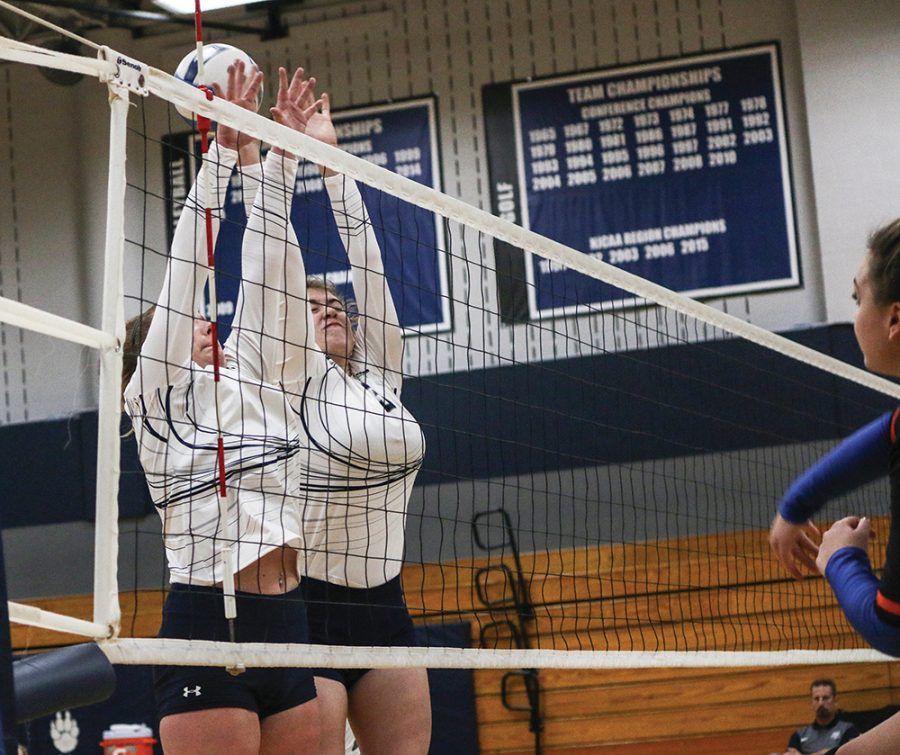 Two+Madison+College+volleyball+players+attempt+to+block+a+shot