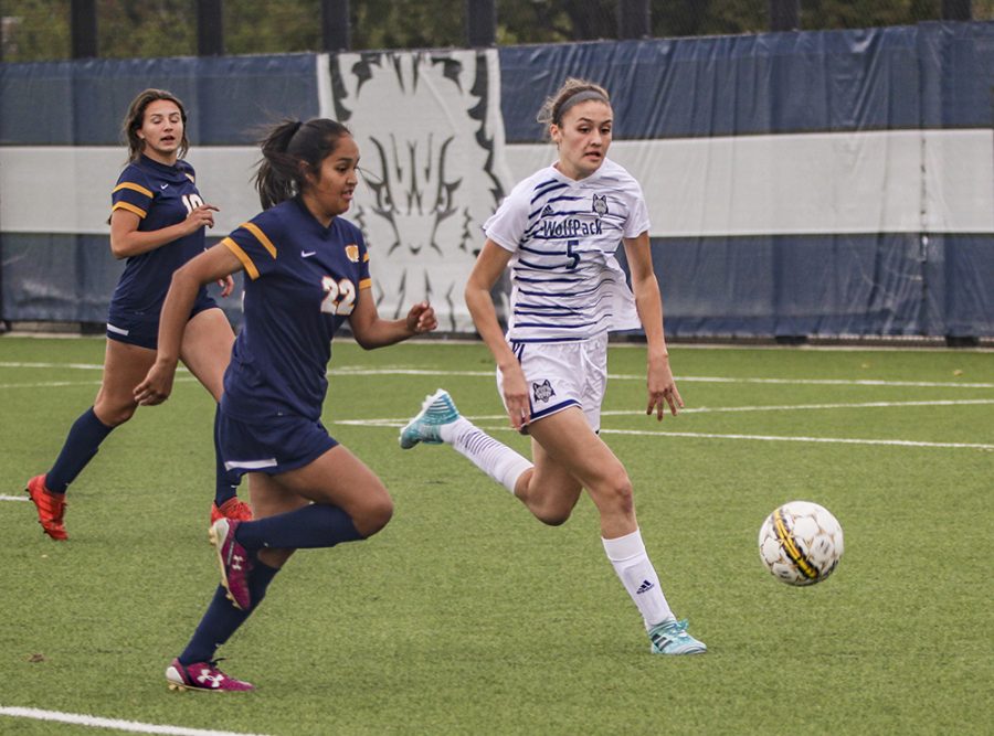 Madison College midfielder Mary Raemisch takes the ball away from an opponent