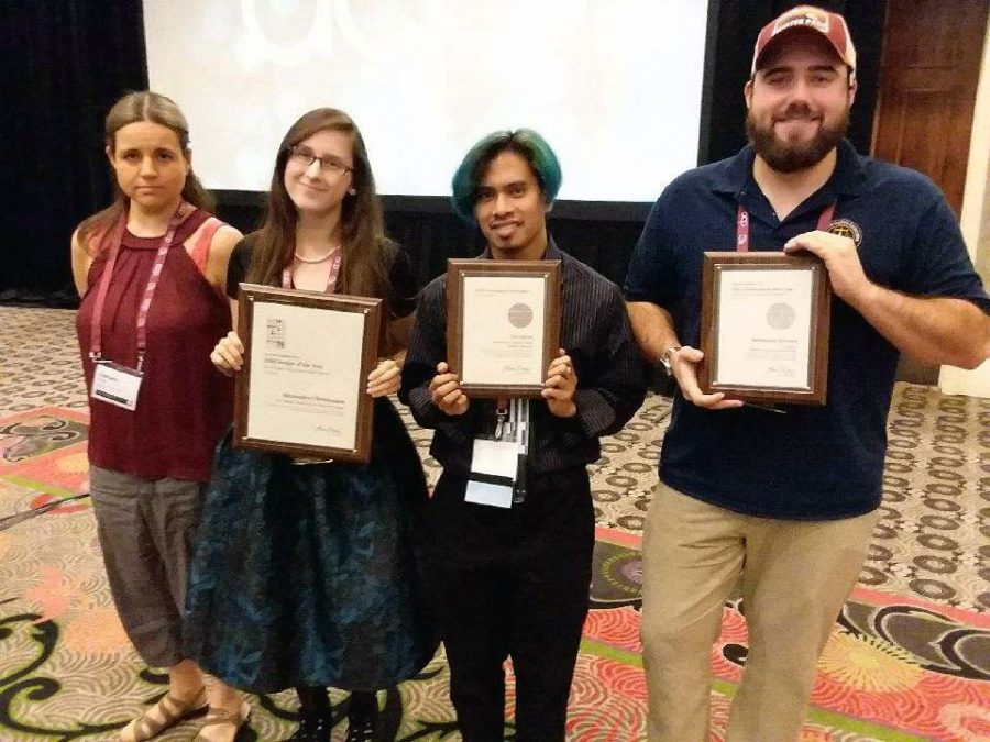 The+Clarion+received+seven+awards+at+the+Associated+Collegiate+Press+National+College+Media+Convention.+Pictured%2C+from+left%2C+are+staff+members+Damara+Gillett%2C+Alexandra+Christensen%2C+Andrew+Kicmol+and+Joe+Craker.