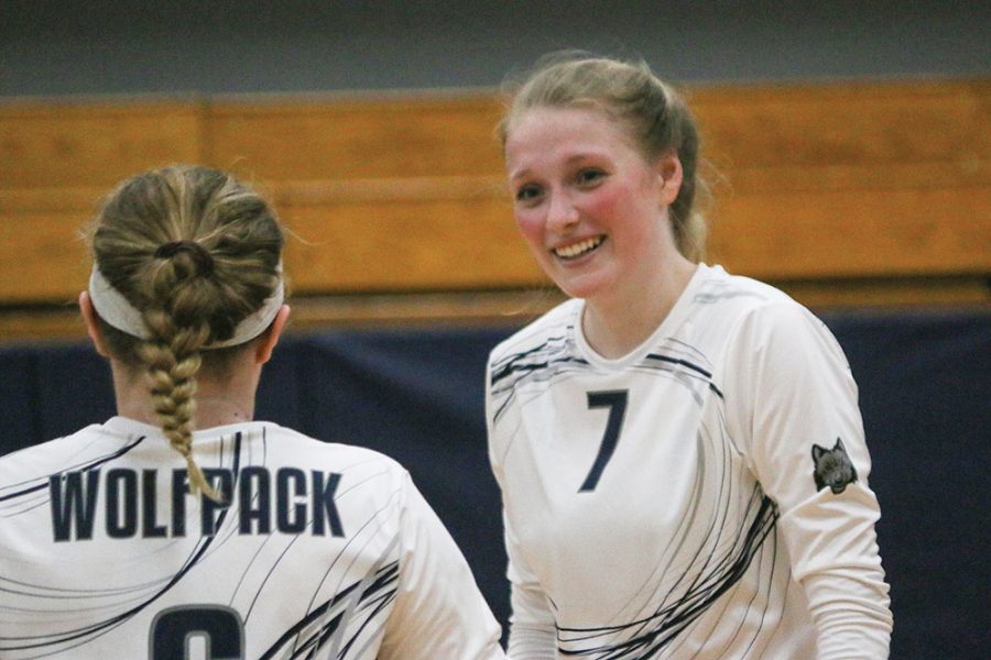 Sophomore volleyball player Paige Hostetler, shown visiting with a teammate during a match earlier this season, was selected as the conference MVP.