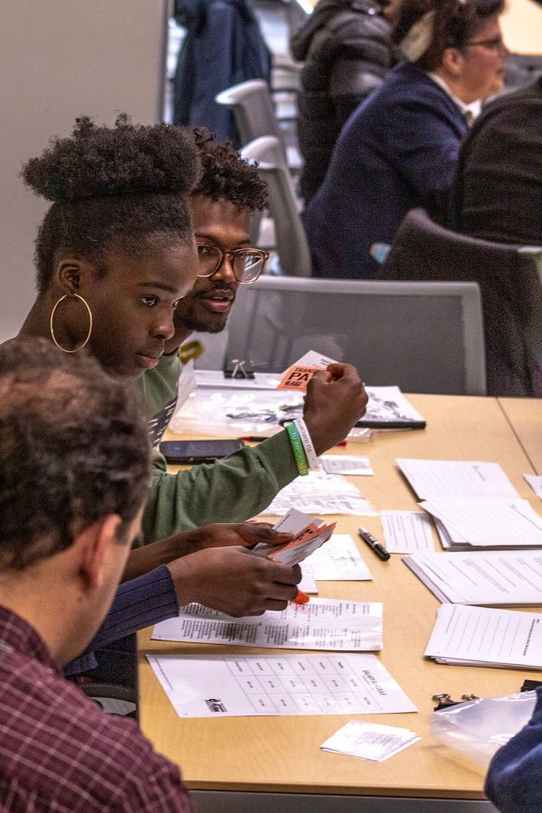 Students help run a station at the poverty simulation activity held this month at the Truax Campus. The event was run by the Office of Equity, Inclusion and Community Engagement.