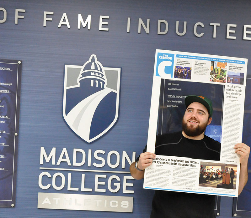 Joe Craker poses for a photo outside the athletic department.