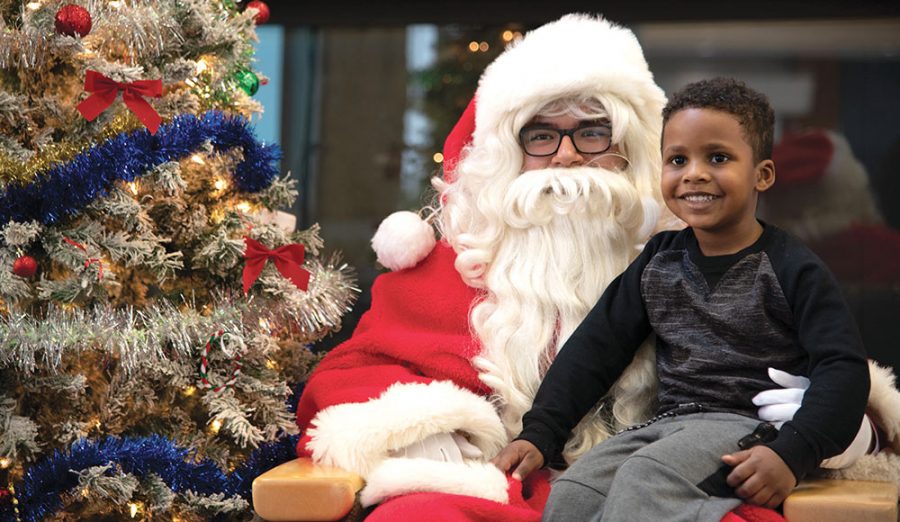 Santa played by student volunteer Jhoan Cosme-Torres brought a lot of smiles to visitors at the Volunteer Center and PAC’s Snacks with Santa event on Dec. 1.
