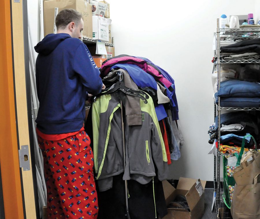 A student looks through items at the Shop the Closet event in the Intercultural Exchange.