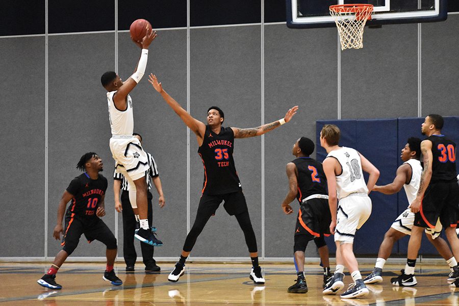 Madison College guard Jalen Addison pulls up for a shot during his team's game against Milwaukee Area Technical College on Feb. 16