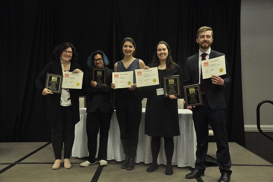 Current and former members of The Clarion display the awards they received at the WNA’s annual convention on March 8. Pictured, from left, are Emily Dimond, Andrew Kicmol, Megan Binkley, Jessica Pokrandt and Sean Bull.