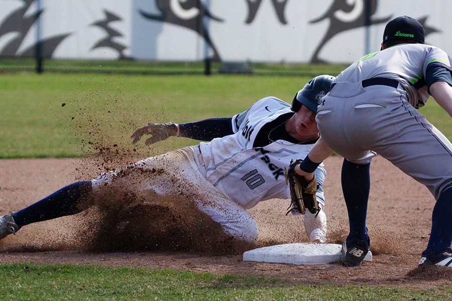 Madison+College%E2%80%99s+Walker+Jenkins+%2810%29+reaches+around+the+tag+as+he+slides+into+second+base+during+his+team%E2%80%99s+6-5+win+over+the+College+of+Lake+County+on+April+16.