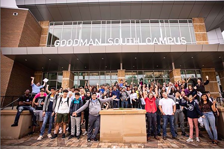 Students and staff gather outside the new Goodman South Campus for a photograph on the first day of classes.