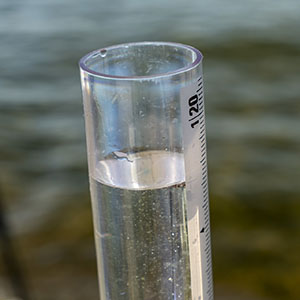 A sample of water from Lake Mendota fills a turbidity tube for a visual observation of water clarity.