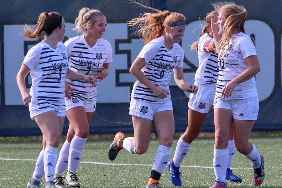 The Madison College women’s soccer team celebrates a goal during a recent match.