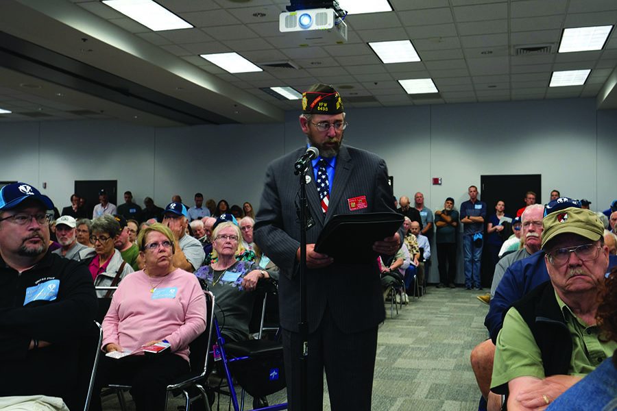 A community member speaks at the Alliant Energy Center during a National Guard Bureau meeting to discuss the environmental impact of bringing two squadrons of F-35A aircraft to the Dane County Regional Airport.