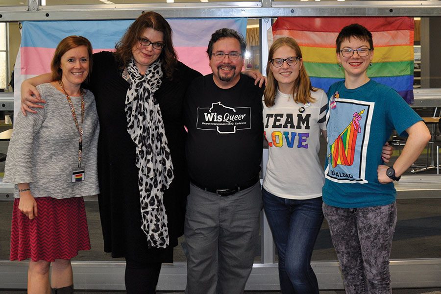 Professor Claire Lind, Co-advisor Emmalee Pearson, Co-advisor Victor Raymond, GSA officer Tierney Miller, and GSA officer Pete Beach gather for a photo after the club’s National Coming Out Day celebration at the Truax Campus on Oct. 11.