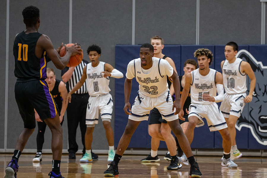 Madison College’s Shamar Newman (22) sets up to defend a McHenry College opponent during his team’s victory on Nov. 5.