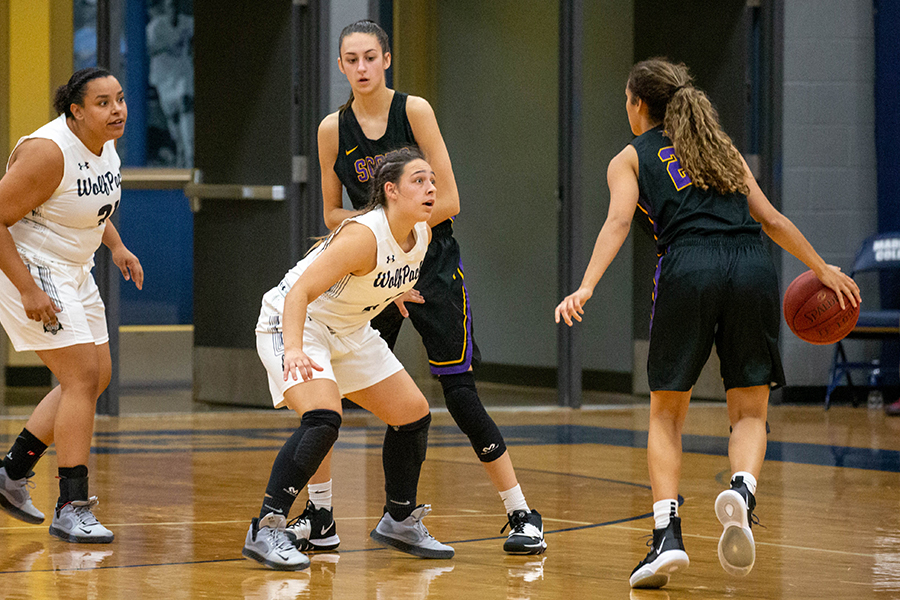 Madison College’s Ceraya Morel (center) guards a McHenry College player as teammate Lilly Dorman (left) helps out on the screen.