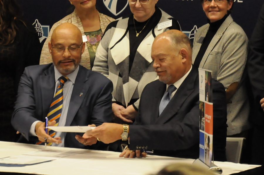 Madison College President Dr. Jack Daniels, right and UW-Plateville Chancellor Dr. Dennis Shields signed three agreements benefiting students in engineering, biotechnology and veterinary technician programs during a ceremony on Nov. 21 at the Truax Campus.