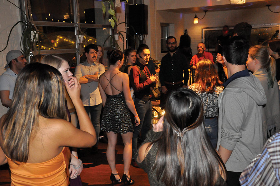 Luis Armacanqui(middle right) and his dance partner Audra (middle left) walk through the cha-cha-cha with the rest of the class.