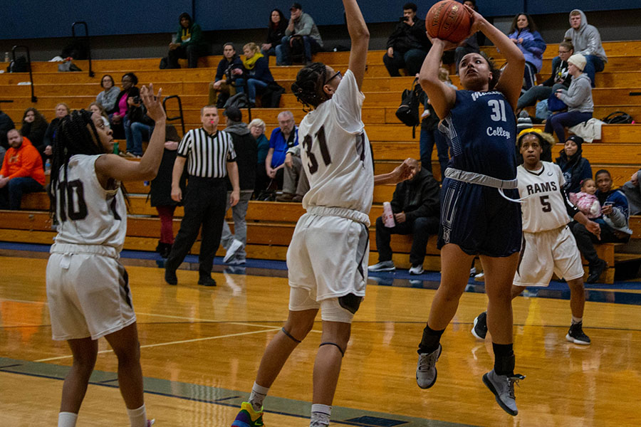 Madison College's Lilly Dorman puts up a shot against Wilbur Wright College.