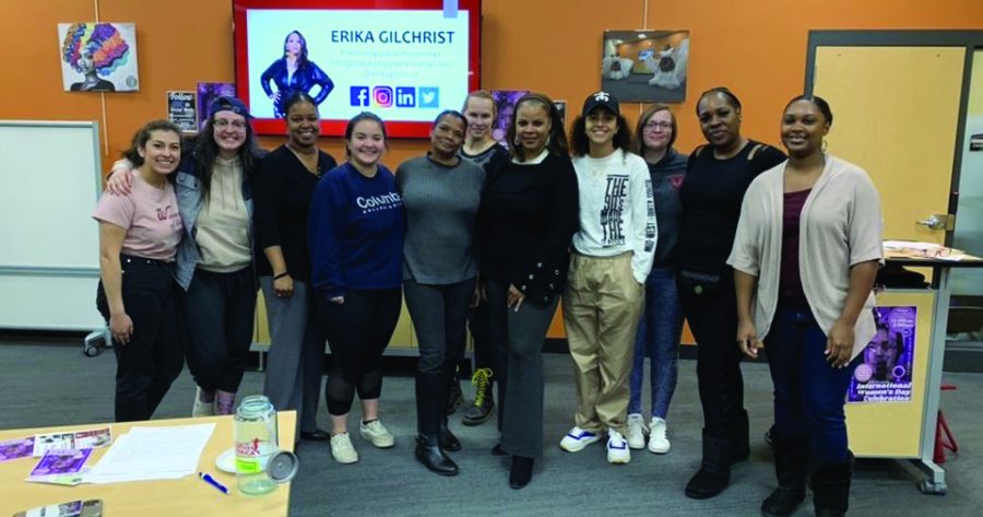 Members of the Programs and Activities Council pose for a photo with speaker Erika Gilchrist after an event on campus this year. PAC was selected as the college’s Outstanding Student Organization of the Year.