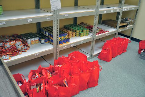The red bags hold up to 10 lbs of food for students available at the college's drive-up food pantry sites.