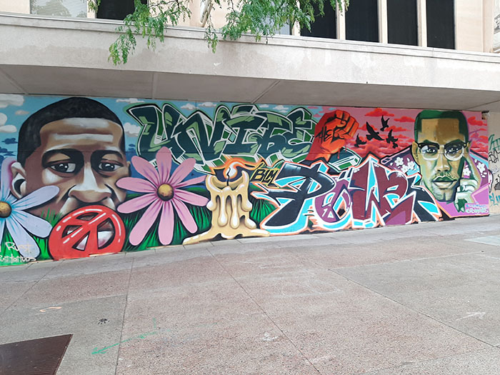 The George Floyd and Malcolm X mural next to the Veterans Museum on West Mifflin Street was created by artists Tony Catteruccia and Lincoln Rust