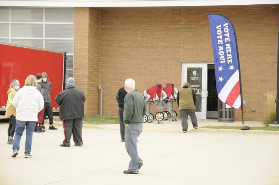 Voters file in to vote on the first day of early voting at the Madison College Protective Services Building at the Truax Campus.