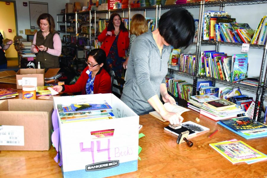 Students participating in the local alternative break trip help with the Madison Reading Project on March 21, 2019. This year’s winter break service trip will be done virtually.