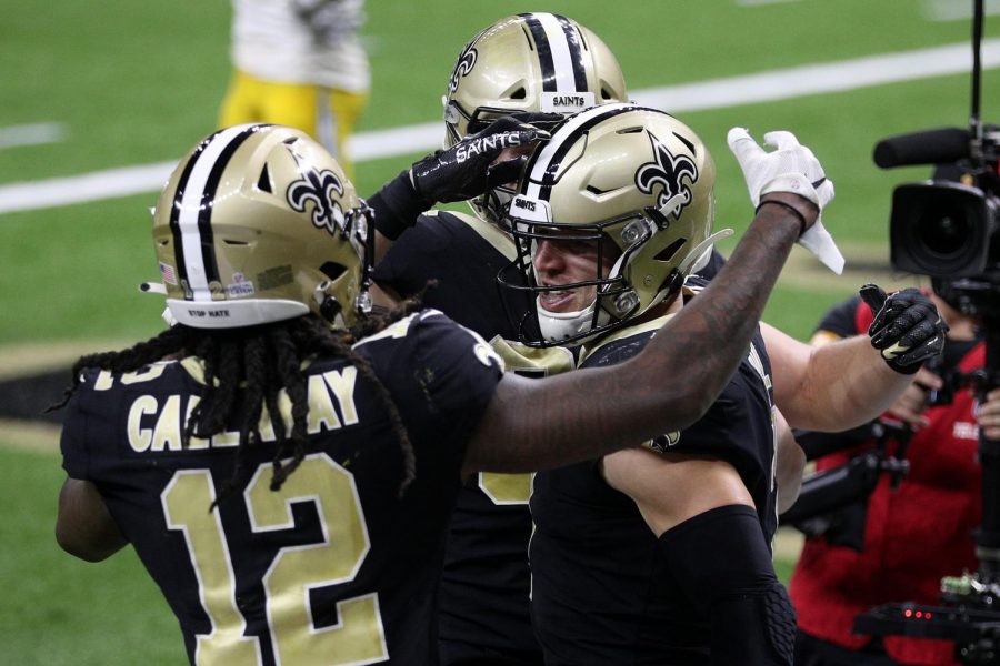 Taysom Hill (7) of the New Orleans Saints celebrates a touchdown against the Los Angeles Chargers with Marquez Callaway (12) on Oct. 12 in New Orleans.