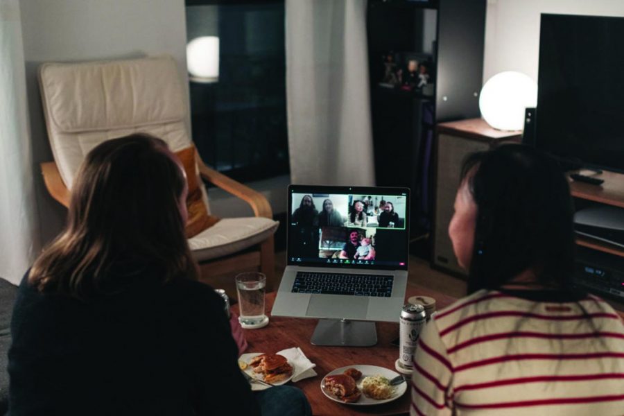 A couple celebrates Thanksgiving with friends by having dinner together over a Zoom video call on November 22, 2020 in New York City. As new COVID-19 cases continue to rise across America, many are forgoing holiday travel and traditional family gatherings out of concern for spreading the virus.
