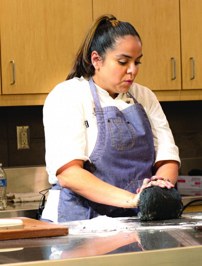 Carolina Diaz, chef at Terzo Piano in Chicago, creating a dish at the Chef series event.