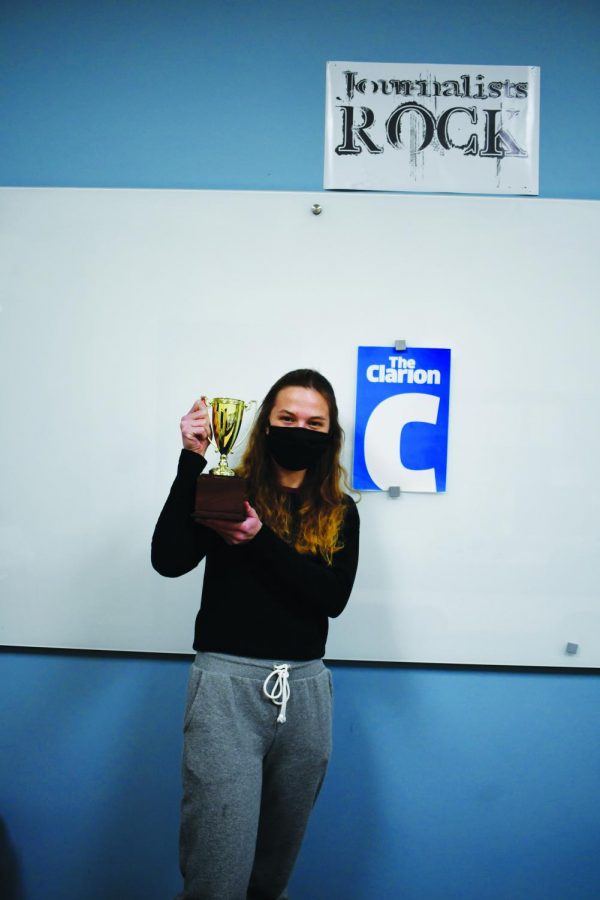 Editor-in-chief Anica Graney holds one of the trophies the Clarion received in a past contest.