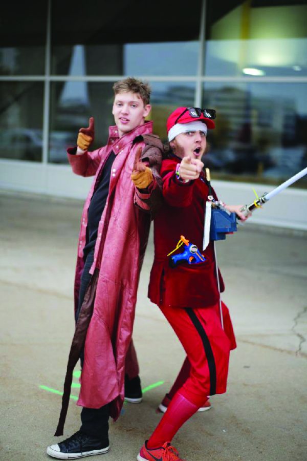 Above, Alan Zarzycki (left) along with a friend as they cosplay characters. Below, a film club meeting held over video chat.