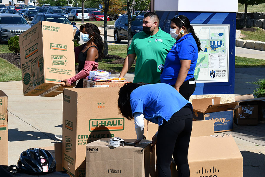 Volunteers load and transport boxes of items donated to help the refugees from Afghanistan.