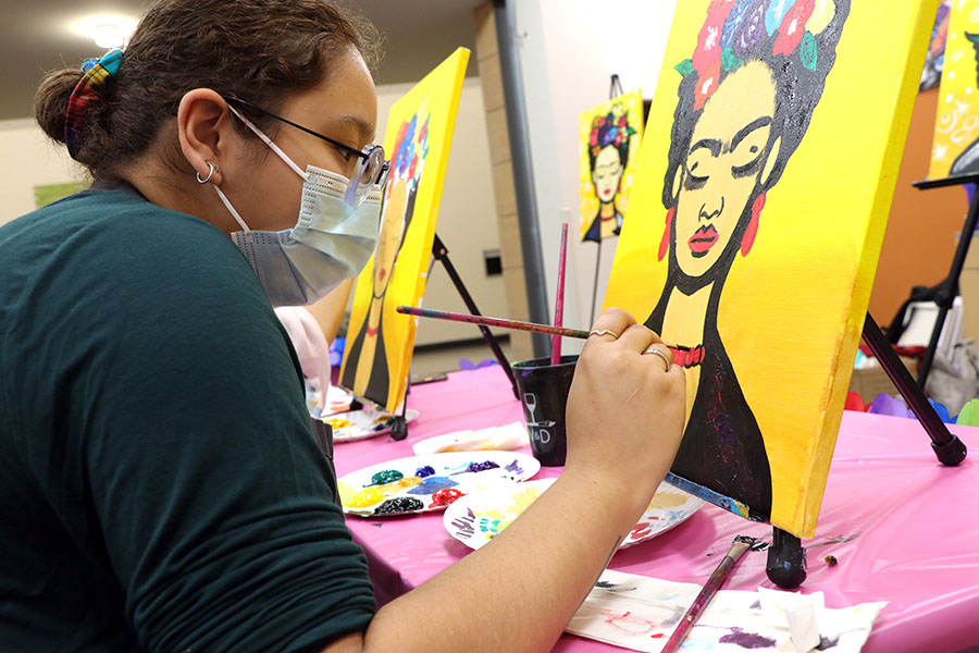 Noely Bonilla paints during the Frida Kahlo event in the Intercultural Exchange.